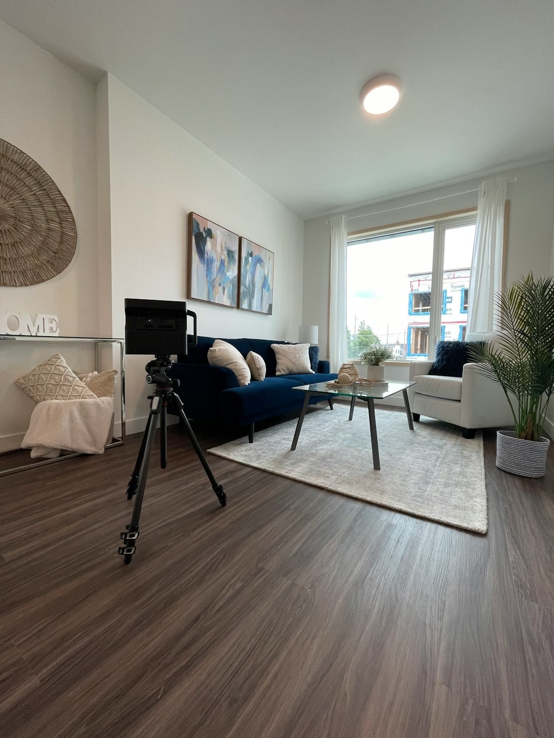 a living room filled with furniture and a large window